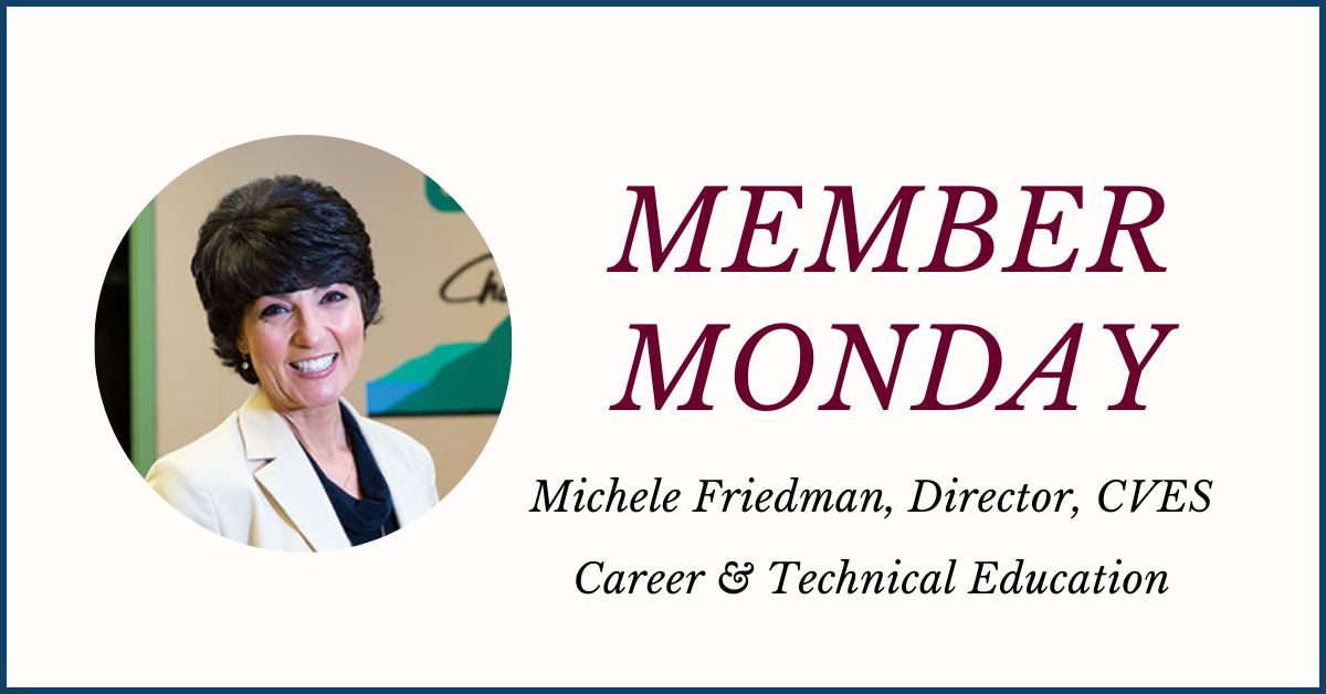 An icon featuring a circular photo at left of Michele Friedman, who has short black hair and is wearing an cream colored jacket and black v-neck t-shirt and is looking at and smiling for the camera. The words Member Monday Michele Friedman, director, CVES Career and Technical Education are displayed at the right.