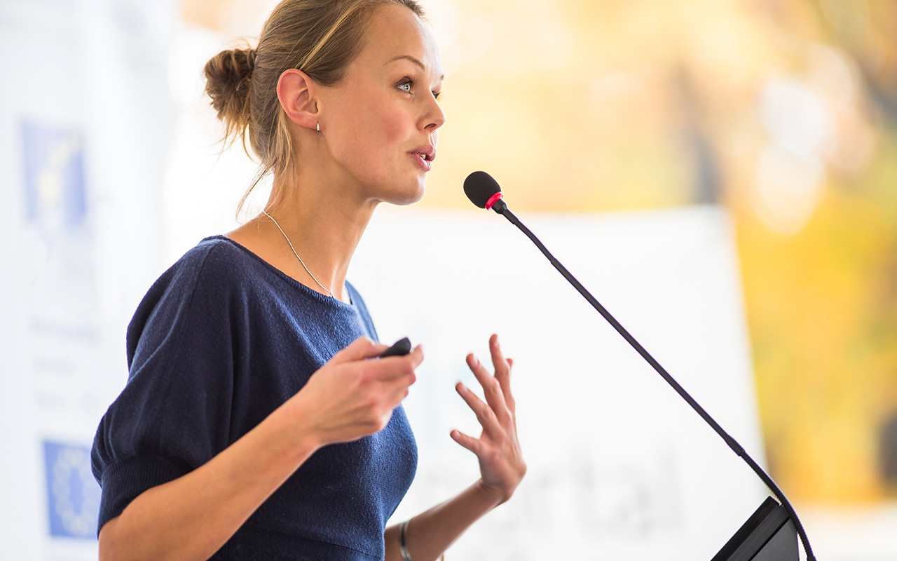 Trainer speaking in front of microphone